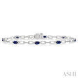 5x3 MM Oval Cut Sapphire and 1/6 Ctw Round Cut Diamond Precious Bracelet in 10K White Gold