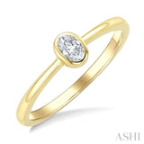 1/5 Ctw Bezel Set Oval Cut Diamond Fashion Ring in 14K Yellow Gold