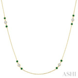 2.25 MM Emerald and 1/2 Ctw Round Cut Diamond Precious Station Necklace in 14K Yellow Gold